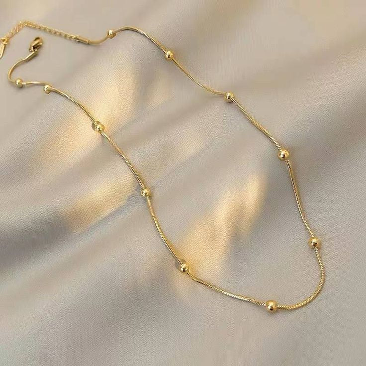 Gold beaded necklace