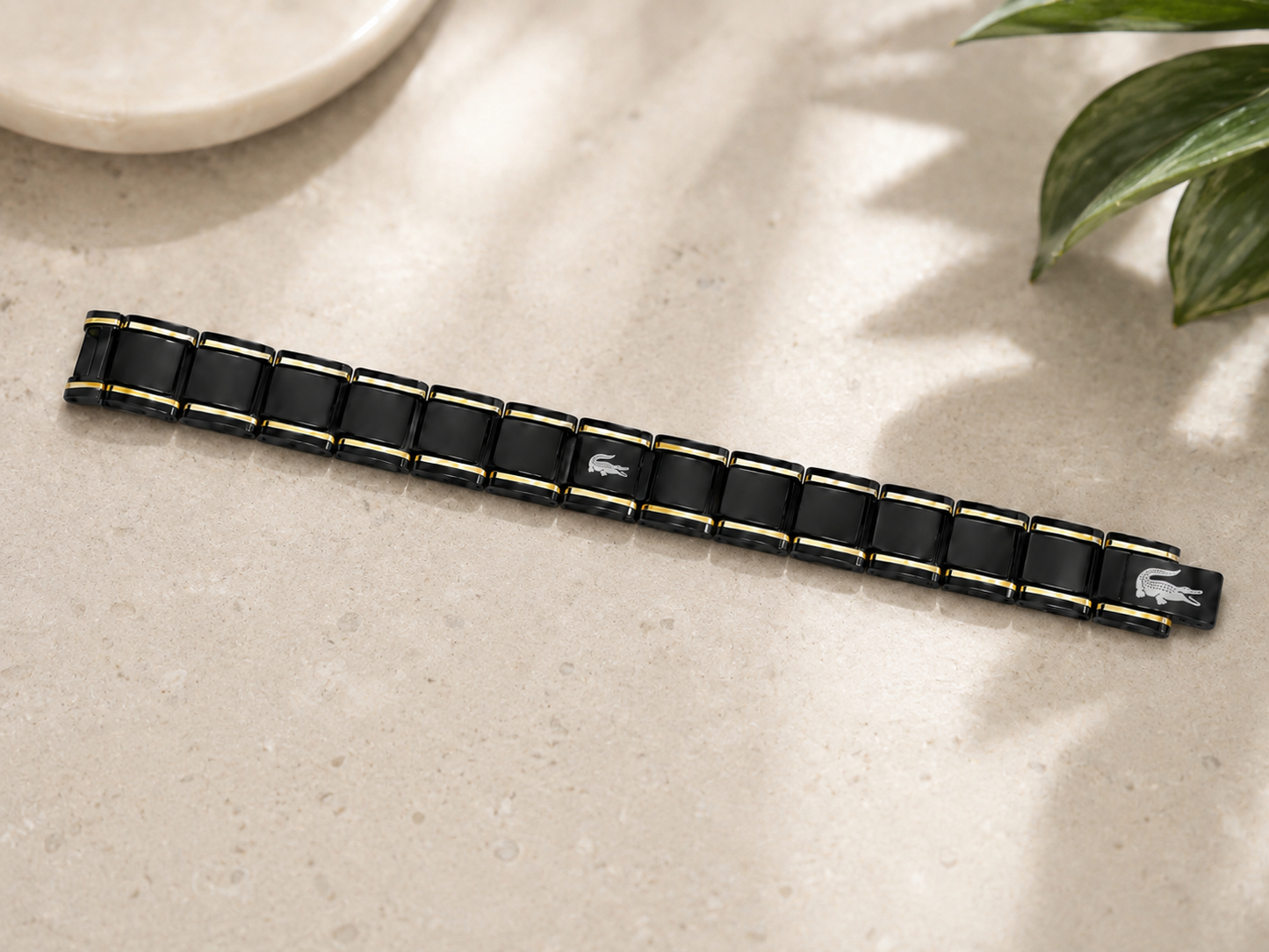 Black and Gold lacoste bracelet